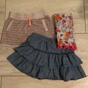 Girls skirt and short set with patterned scarf.